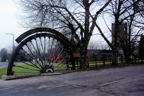 This picture shows half of a winding wheel fixed in the ground